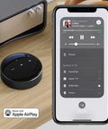 AirPlay 2 Wireless Audio Streamer for Multiroom Stereo and TV Audio Preamplifier Turns Your Home Stereo Into a Smart Speaker Works With Alexa and Siri Streams Hi Res From Amazon Music Tidal and More next to smartphone showing audio streaming interface