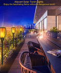 4 Pack 43 Inch Solar Torch Lights With 96 LEDs, Outdoor Waterproof Landscape Pathway Lighting, Realistic Flickering Flame Effect For Patio Vibes, Dusk To Dawn Auto On Off, Yard Garden Decor installed on modern patio at sunset