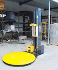 Straight Shots Automatic Shrink Wrap Machine Built Tough For Heavy Duty Pallet Wrapping And Seamless End Of Line Automation, in warehouse setting.