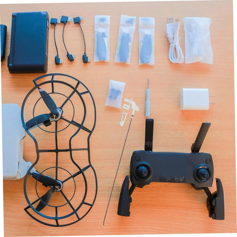 20 Pack Heavy Duty Metal RC Airplane Linkage Stoppers Plus Adjustable Push Rod Connectors For Fixed Wing Models Quick Swaps DIY Mods Rock Solid Flyin Gear laid out with USB cables and battery.