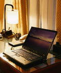 Three Way Dimmable Touch Lamp For Nightstand With USB Ports And Outlet, Linen Shade, on desk with laptop and accessories