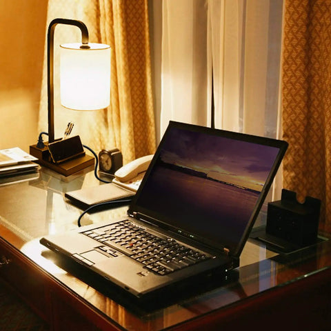 Three Way Dimmable Touch Lamp For Nightstand With USB Ports And Outlet, Linen Shade, on desk with laptop and accessories