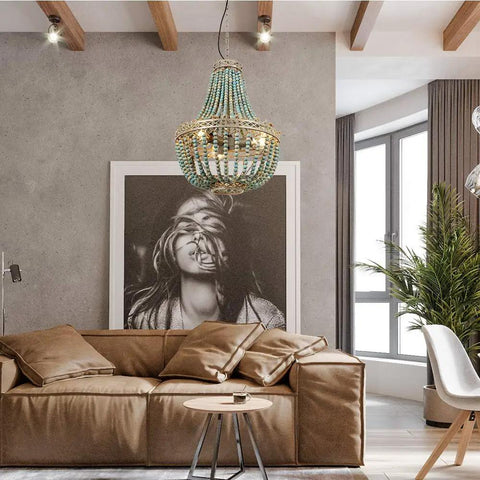 Three Light Wood Beaded Chandelier in Rustic Farmhouse Vibe over brown sofa in modern living room with art and large window