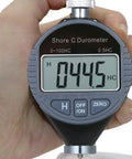 Digital Shore Hardness Durometer With Crisp LCD Measures Rubber Elastomers Plastics And Composite Rigidity Across A C D Scales in hand.