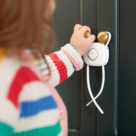OutSmart Flex Lock Childproof Cabinet Locks White 2 Pack With Decoy Button And Flexible Design No Drill Install Fits Cabinets From 3 To 8 Inches Apart On Knobs Or Handle Pulls Easy To Install And Keep Curious Toddlers Safe