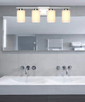 4 Light Brushed Nickel Bathroom Vanity Light Fixture With Frosted Glass Shades Over Mirror Wall Sconce Shown in Modern Bathroom