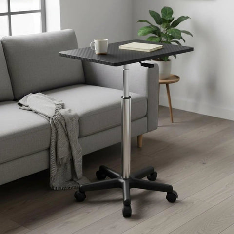 Straight Up Solid Adjustable Rolling Laptop Desk With Heavy Duty Steel Base Mobile Standing Work Table next to a couch.