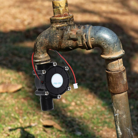 Mini Hydropower Generator Turbine Kit attached to outdoor water pipe for DIY projects