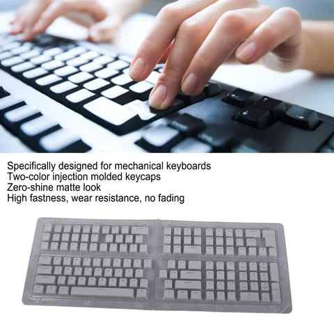 Close-up of hands typing on a keyboard with Top Shelf Pbt Translucent Pudding Keycaps For Mechanical Keyboards Two Tone Injection White Switch Ready 132 Piece Set.