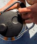 Close-up of Rambler Gallon Water Jug With Vacuum Insulated Stainless Steel No Sweat Design MagCap Magnetic Lid being opened