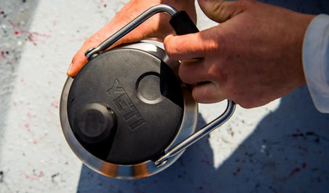 Close-up of Rambler Gallon Water Jug With Vacuum Insulated Stainless Steel No Sweat Design MagCap Magnetic Lid being opened