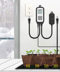 Smart WiFi Cooling And Heating Thermostat Outlet With Tuya Controller for plant temperature control, mounted next to seedlings.