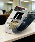Beast Mode Fast Money Counter With UV Counterfeit Detection Portable Cash Counter For Bills and Currency on office desk