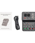 Top view of a Two Channel DJ Mixer For Laptop Tablet And Phone With 16Bit 48KHz Audio Resolution alongside manual and cable.