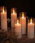 Image of a set of 5 battery operated flameless LED pillar candles with acrylic shell and realistic 3D wick, warm yellow glow, 5 to 8 inch heights.