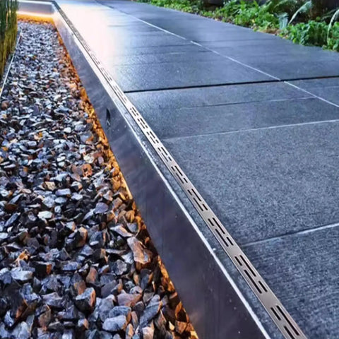 All In One Stainless Steel Trench Drainage System Kit With Outdoor Grate For Courtyards And Driveways installed beside driveway