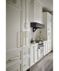Davenport Honey Bronze Cabinet Pull 5-1/16 Inch Center To Center installed on white kitchen cabinets for a timeless finish.