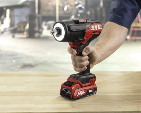 Tough As Nails Brushless Impact Wrench Delivering Eight Hundred Foot Pounds Of Mid Torque With Three Speed Settings Plug And Play Cordless Kit with USB-C battery, held by hand.