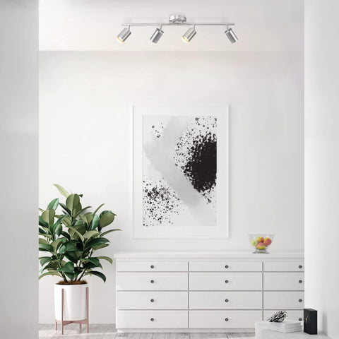 Pratt 4 Light Track Lighting Fixture in Brushed Nickel With Pivoting Heads in modern living room, minimalist decor.