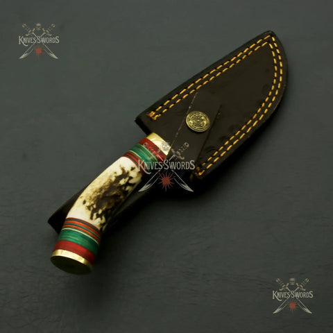 Beefy Stainless Steel Fixed Blade Knife With Wood Bolster Handle And Leather Sheath 8 Inch Overall 4 Inch Blade For Outdoor Camping And Collector Use For Everyday Carry in embroidered sheath, handle detail view.