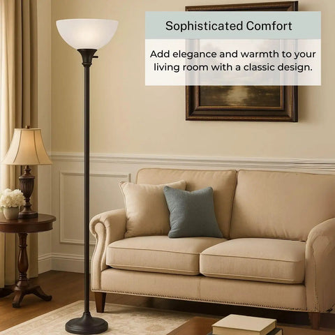 Bronze 72 Inch Torchiere Floor Lamp With Glass Shade in cozy living room corner.