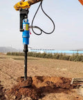 Heavy Duty Mini Excavator Earth Auger Drive 1200 To 2000 Nm Hydraulic Post Hole Digger drilling soil in farm landscape