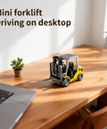 Mini One Sixty Fourth Scale RC Forklift Toy With 2 In 1 Transformable Lift Fork And Hook on wooden desk near laptop