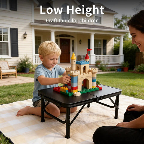 Child playing with blocks on Ultra Portable Camping Table With Aluminum Frame, Lightweight 4.85 Lb Design, Adjustable Height Up To 21 Inches
