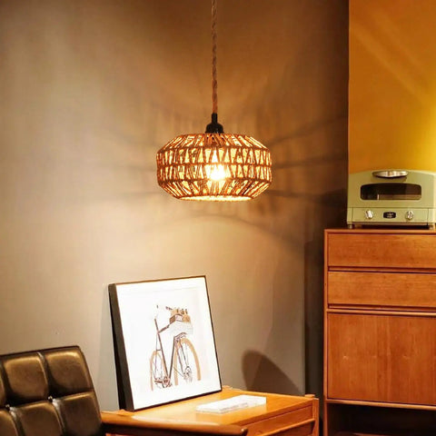 Two Pack Mini Rattan Plug In Pendant Lights Hand Woven Boho Ceiling Fixture With Switch Easy Install Home Upgrade For Bedroom Entryway Hallway Cozy Vibes hanging over a wooden side table with artwork.