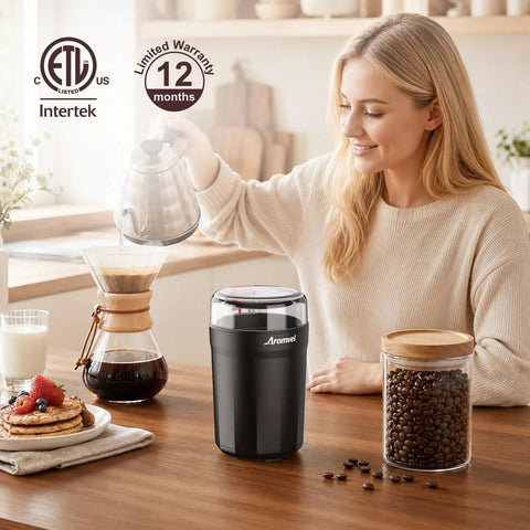 One Touch Coffee Grinder With Stainless Steel Blades; woman brewing coffee with fresh beans in kitchen
