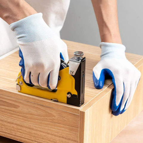 Person using Heavy Duty 4 In 1 Staple Gun With 6000 Staples Remover Gloves And Manual Brad Nailer Adjustable Power on wood project