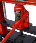 Pro Grade Hydraulic Shop Press Boasts A Rock Solid 12 Ton Capacity With Stable Floor Mount Framing And Flexible Adjustable Work Surfaces For No Sweat Garage Repairs Today, featuring a 12-ton red hydraulic bottle jack.