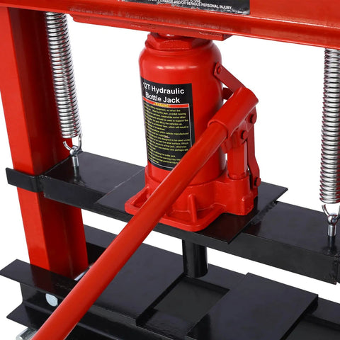 Pro Grade Hydraulic Shop Press Boasts A Rock Solid 12 Ton Capacity With Stable Floor Mount Framing And Flexible Adjustable Work Surfaces For No Sweat Garage Repairs Today, featuring a 12-ton red hydraulic bottle jack.