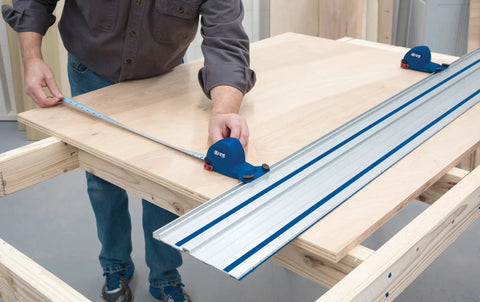 Man using Adaptive Cutting System Parallel Guides For Track Saws ACS415 on plywood for precise straight cuts