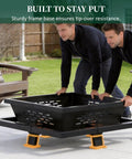 Two people assembling 42 Inch Outdoor Fire Pit Heavy Duty Wood Burning Firepit With Poker For Camping Backyard Patio Beefy Steel Pit Delivers 4 Ft Warmth Radius Holds 25 Lbs Wood For Hours Of Cozy Firelight.