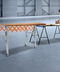 Heavy Duty Adjustable Gravity Roller Table With Rolling Caster Wheels Expandable Extendable Conveyor Belt For Moving Heavy Loads Easy Folding Storage in workshop.
