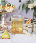 Straight Up Quality Double Walled Glass Tea Cup With Stainless Steel Loose Leaf Infuser Basket And Heatproof Borosilicate Design Solid Eight Ounce Brewing Mug For Every Sip with tea and desserts