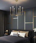 Farmhouse Style Gold Candle Chandelier With Brushed Brass Finish 6 Light Mid Century Branches Ceiling Fixture in bedroom setting
