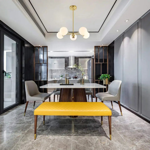 Grammercy 5 Light Chandelier Pendant In Brushed Brass With White Frosted Globes hanging in dining room setting