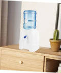 Go-To Mini Desktop Cold Water Dispenser With Built In Tap on wooden tabletop next to potted cactus, space-saving design