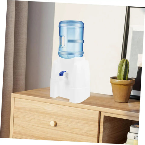 Go-To Mini Desktop Cold Water Dispenser With Built In Tap on wooden tabletop next to potted cactus, space-saving design