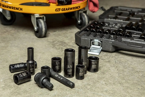 65 Piece 1/2 Inch Drive Impact Socket Set Standard And Deep SAE And MM Off Corner Loading Black Oxide Finish on workshop floor