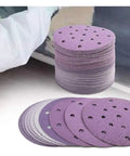 Kick Ass 6 Inch Sanding Discs With 17 Holes For Fast Dust Extraction Hook And Loop Backing That Sticks Tight stacked for use on wood or metal.