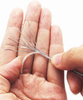 Close-up of braided strands from Heavy Duty Coated Picture Hanging Wire #6, illustrating flexibility and finger-friendly design.