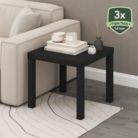Classic Homey Square Parsons Side End Table In Black 1 Pack next to a sofa, featuring a minimalist design with 1.8 inch thick top