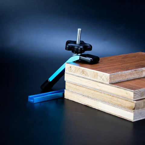 Blue T Track Clamps For Woodworking Set Of 4 Hold Down Clamps With 5 Inch Length And T Slot Bolts on wooden boards.