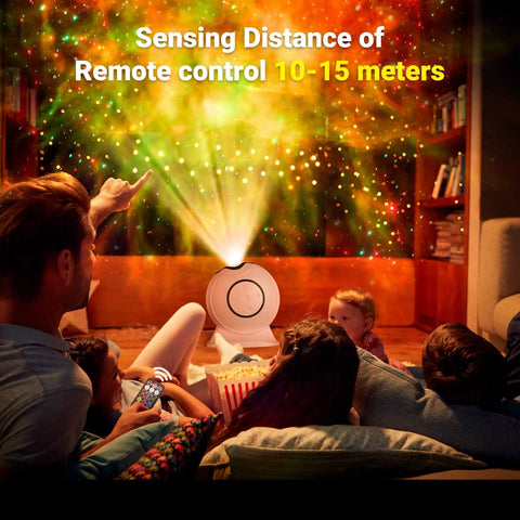 Family using Lit Galaxy Projector With Remote Control for vibrant starry sky effect in home theater setting