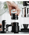 Hella Smooth Espresso Bed Leveler Cyclone Coffee Distributor Spinner For 51 58 Mm Portafilters being placed on coffee grounds in portafilter.