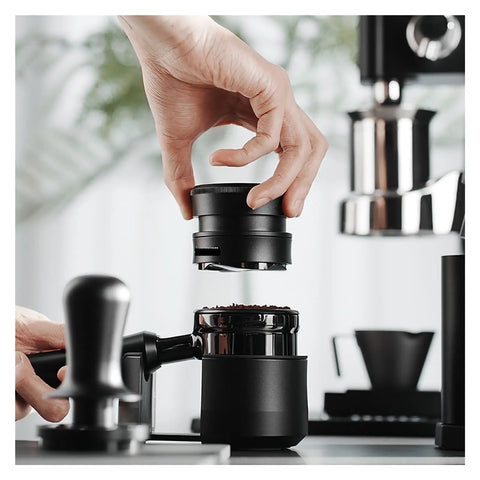 Hella Smooth Espresso Bed Leveler Cyclone Coffee Distributor Spinner For 51 58 Mm Portafilters being placed on coffee grounds in portafilter.