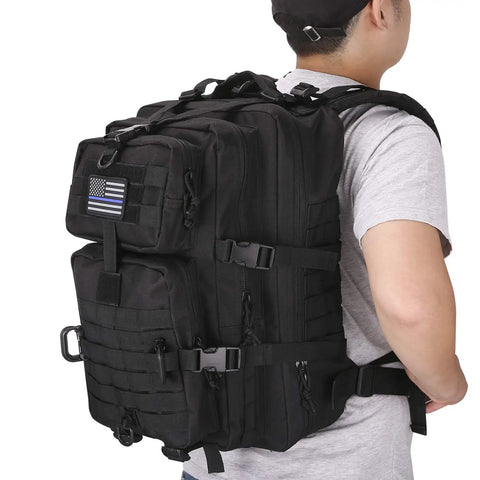 Person wearing MOLLE Assault Backpack 40L Tactical Military Rucksack 3 Day Pack With USA Flag Patch; side view
